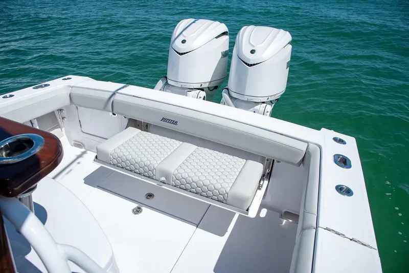 Slide: The Image of Manufacturer Provided Image: 2026 Jupiter 30 boat with twin engines, white seating, and sleek design on clear blue water. - 8