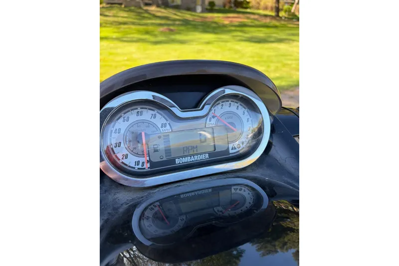 Slide: The Image of Dashboard of a 2004 Sea-Doo GTX 4-TEC Supercharged, showing speedometer and RPM gauges. - 2