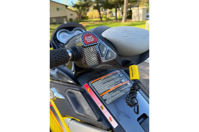 Slide: The Image of 2004 Sea-Doo GTX 4-TEC Supercharged handlebar with start/stop button and safety lanyard. - 3
