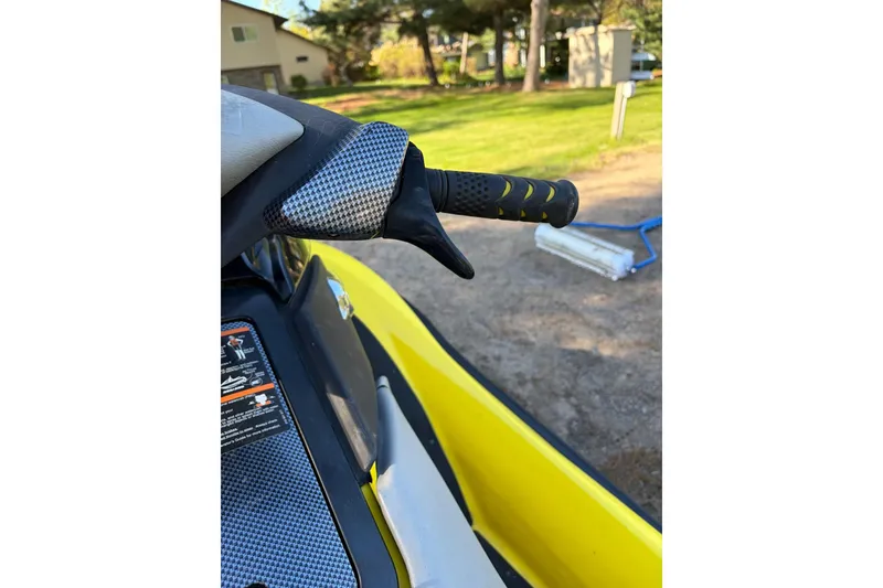 Slide: The Image of Close-up of 2004 Sea-Doo GTX 4-TEC Supercharged handlebar with carbon fiber detail. - 4