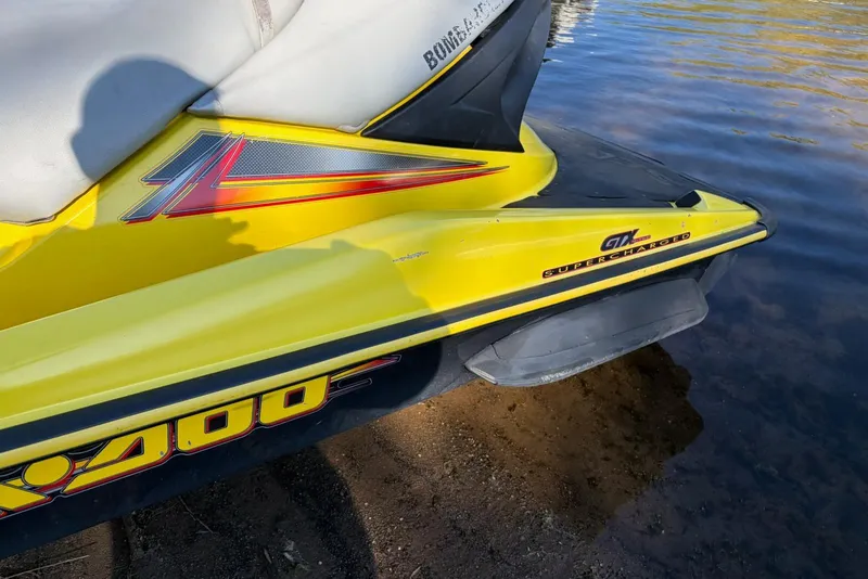 Slide: The Image of 2004 Sea-Doo GTX 4-TEC Supercharged jet ski in shallow water. - 5