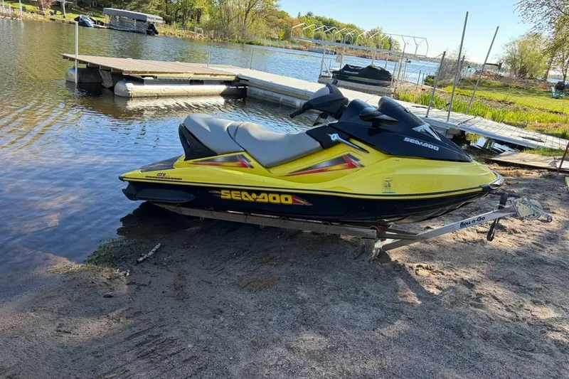 Slide: The Image of 2004 Sea-Doo GTX 4-TEC Supercharged jet ski on trailer by lakeside dock. - 7