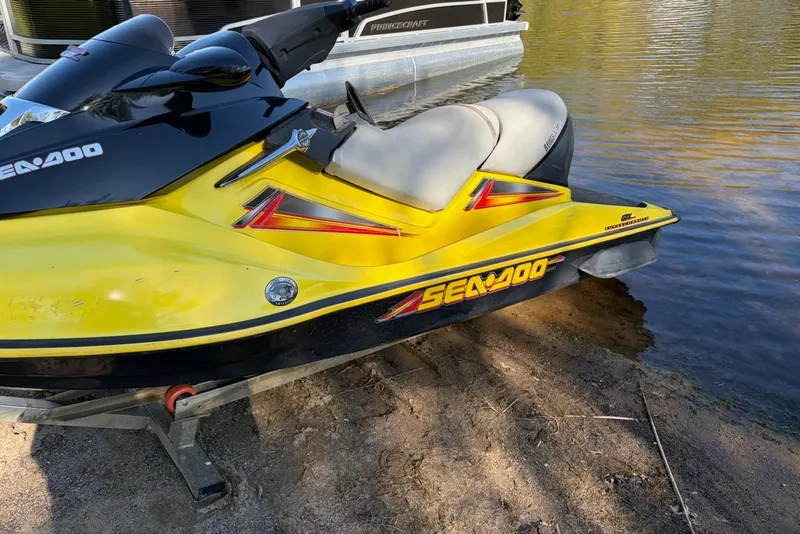 Slide: The Image of 2004 Sea-Doo GTX 4-TEC Supercharged jet ski on sandy shore. - 9