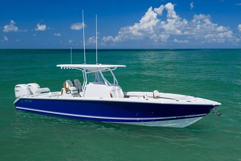Slide: The Image of Manufacturer Provided Image: 2026 Jupiter 32 boat on turquoise ocean under clear blue sky. - 2