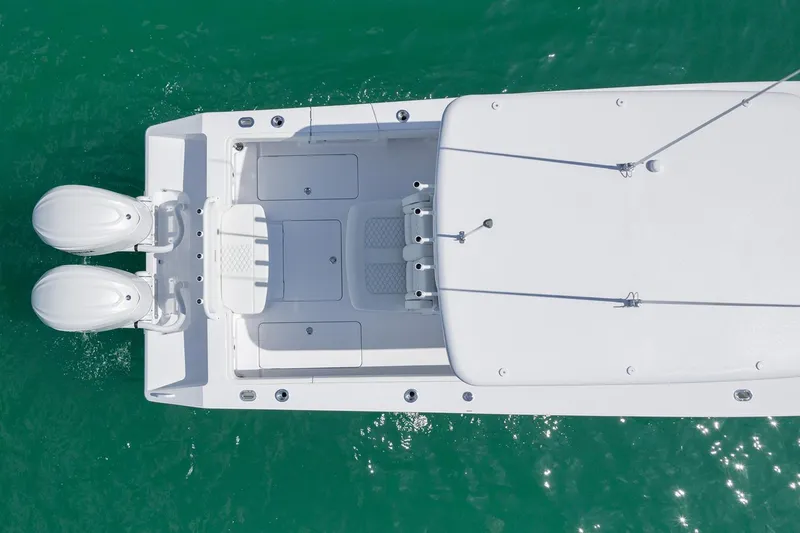 Slide: The Image of Manufacturer Provided Image: Aerial view of 2026 Jupiter 32 boat with dual engines on turquoise water. - 8