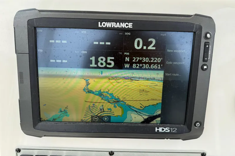 Slide: The Image of Lowrance HDS12 marine GPS displaying navigation data on a Key West 239 FS, 2014 model. - 23