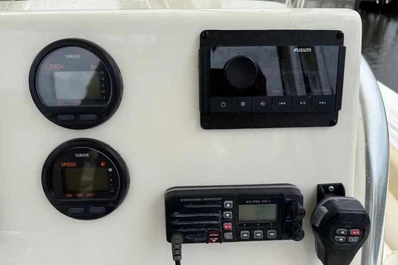 Slide: The Image of Dashboard of a 2014 Key West 239 FS boat with Yamaha gauges and Fusion audio system. - 25