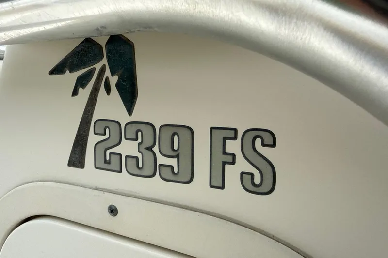 Slide: The Image of 2014 Key West 239 FS boat logo with palm tree design. - 29
