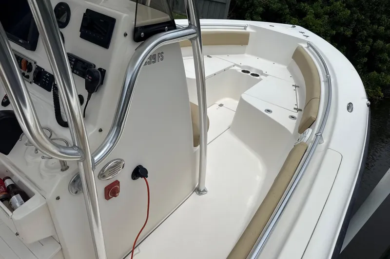 Slide: The Image of 2014 Key West 239 FS boat interior with console and seating area. - 30