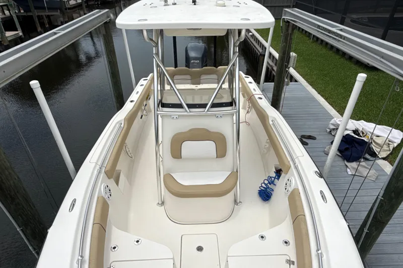 Slide: The Image of 2014 Key West 239 FS boat docked, featuring spacious seating and sleek design. - 34