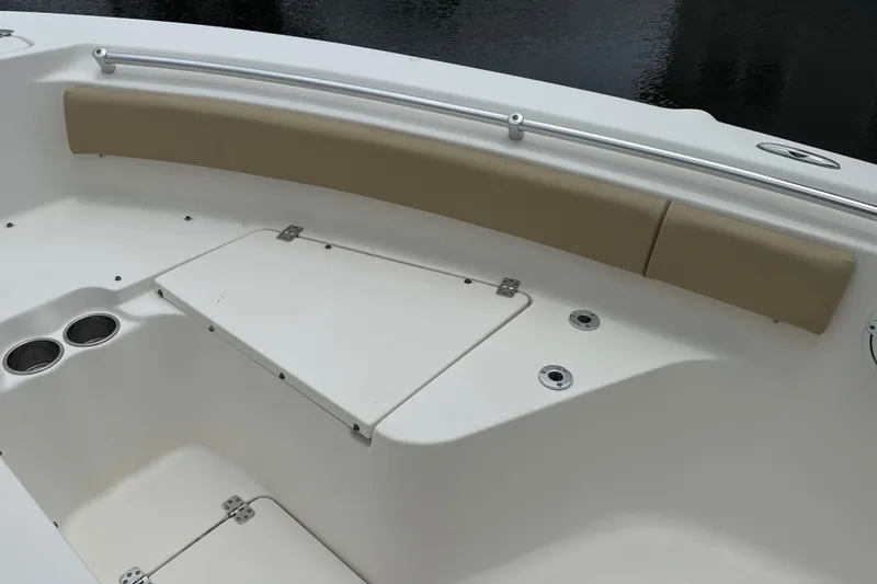 Slide: The Image of Bow seating area of a 2014 Key West 239 FS boat with storage compartments. - 40