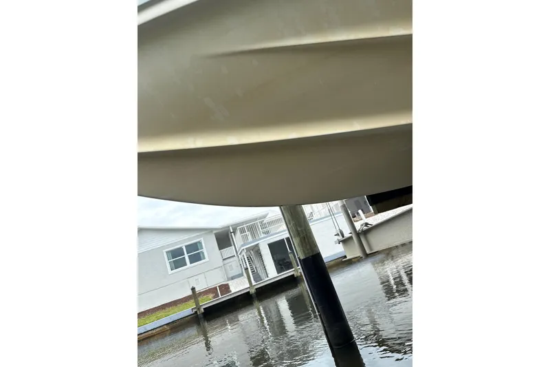 Slide: The Image of Underwater view of a 2014 Key West 239 FS boat hull near a dock. - 42