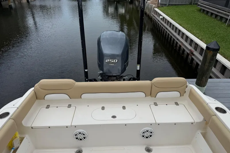 Slide: The Image of 2014 Key West 239 FS boat with Yamaha 250 engine, docked in a canal. - 6