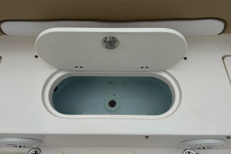 Slide: The Image of Open storage compartment on 2014 Key West 239 FS boat. - 8