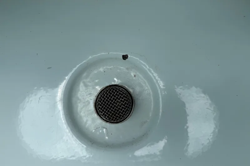 Slide: The Image of Close-up of a drain on a 2014 Key West 239 FS boat. - 9