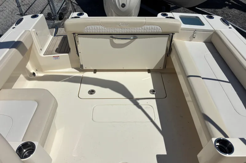 Slide: The Image of 2026 Scout 220 Dorado boat interior with seating and cup holders. - 16