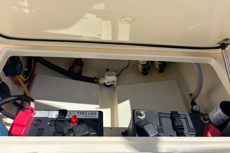 Slide: The Image of Battery compartment of a 2026 Scout 220 Dorado boat, showing wiring and components. - 19