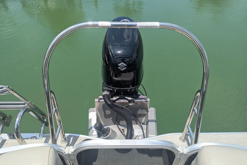 Slide: The Image of 2021 Trifecta 22RF LE boat with Suzuki outboard motor on calm water. - 10