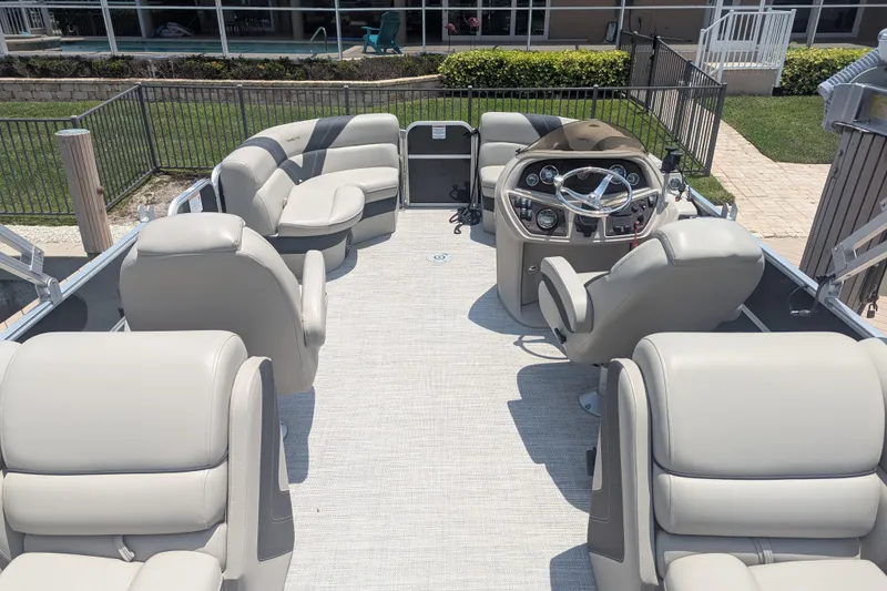 Slide: The Image of Luxurious 2021 Trifecta 22RF LE pontoon boat interior with plush seating and modern helm. - 4