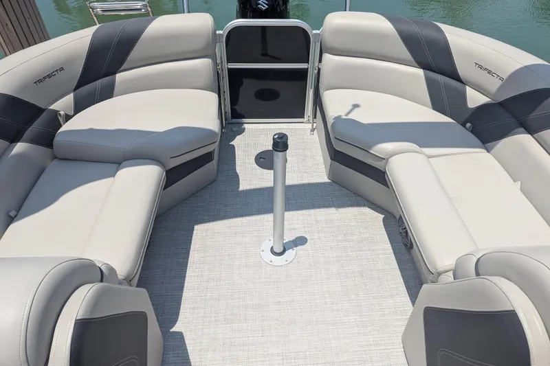 Slide: The Image of Luxurious seating on 2021 Trifecta 22RF LE pontoon boat, featuring elegant upholstery and spacious layout. - 6