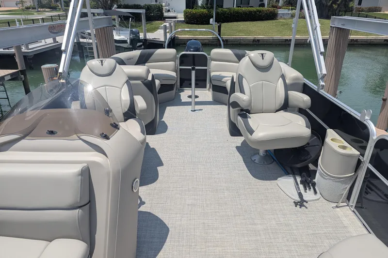 Slide: The Image of Luxurious 2021 Trifecta 22RF LE pontoon boat interior with plush seating and modern design. - 7