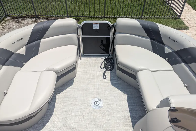 Slide: The Image of Interior of a 2021 Trifecta 22RF LE pontoon boat with plush seating and modern design. - 8