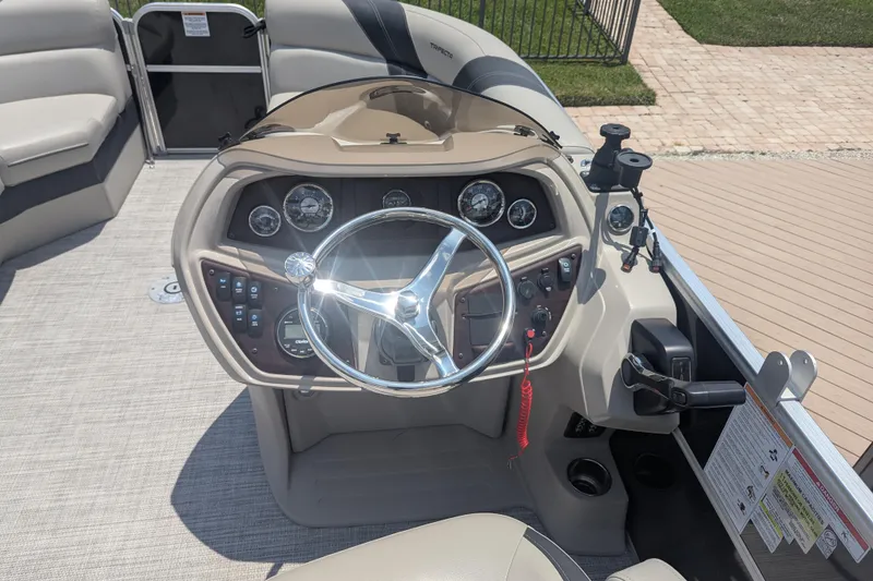 Slide: The Image of Steering console of 2021 Trifecta 22RF LE pontoon boat with gauges and controls. - 9