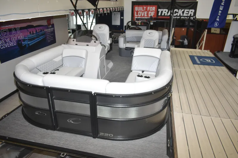 Slide: The Image of 2012 Crest 230 Prestige SLR pontoon boat with luxurious seating and modern design in showroom. - 10
