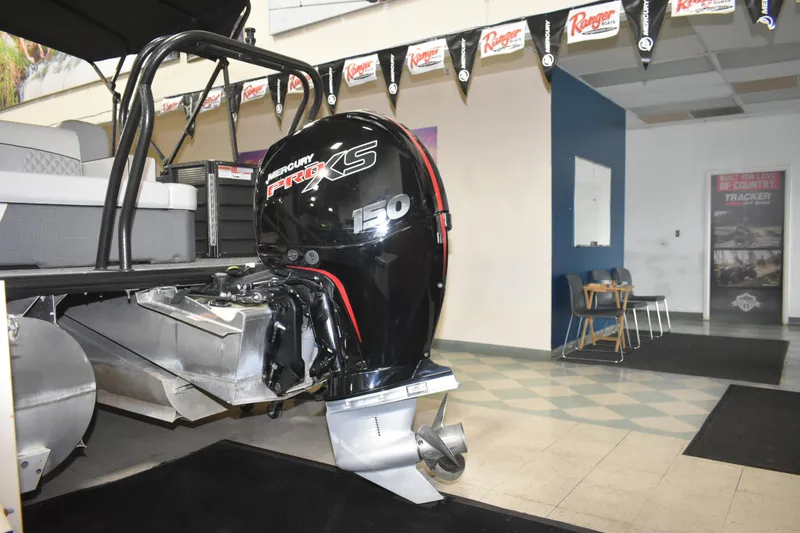 Slide: The Image of 2012 Crest 230 Prestige SLR boat with Mercury Pro XS 150 outboard motor in showroom. - 13