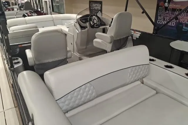 Slide: The Image of 2022 Crest Classic Platinum 220 boat interior with luxurious seating and modern helm. - 16
