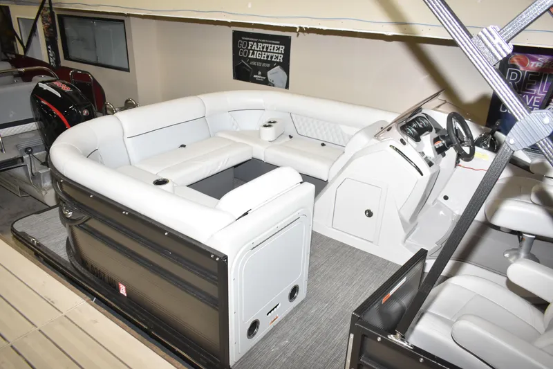 Slide: The Image of 2012 Crest 230 Prestige SLR pontoon boat with luxurious white seating and modern dashboard. - 17