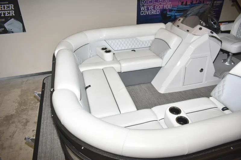 Slide: The Image of Luxurious interior of 2012 Crest 230 Prestige SLR pontoon boat with plush seating and cup holders. - 18