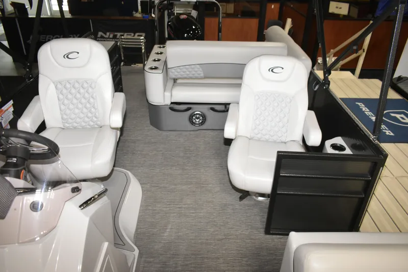 Slide: The Image of Interior of a 2012 Crest 230 Prestige SLR boat with luxurious white seating. - 22