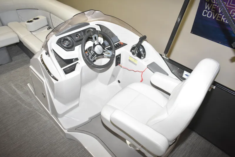 Slide: The Image of Interior of 2012 Crest 230 Prestige SLR boat, featuring a modern helm and seating. - 23