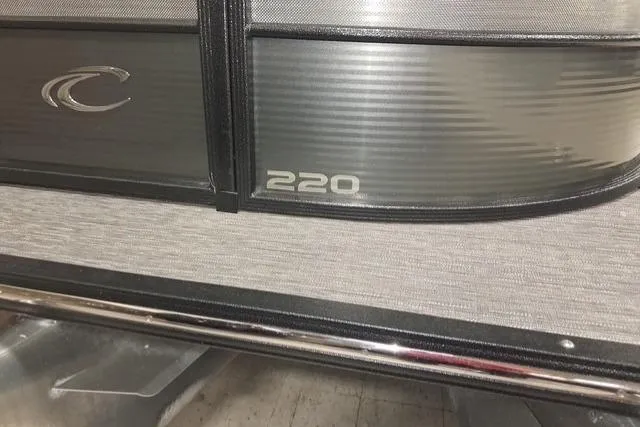 Slide: The Image of 2022 Crest Classic Platinum 220 pontoon boat, featuring sleek metallic design and branding. - 27