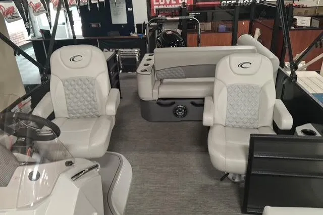 Slide: The Image of 2022 Crest Classic Platinum 220 boat interior with luxurious seating and modern design. - 6