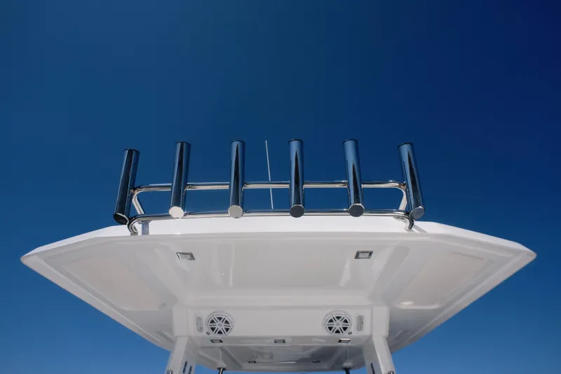 Slide: The Image of Schaefer V33SF 2027 boat roof with fishing rod holders against blue sky. - 10