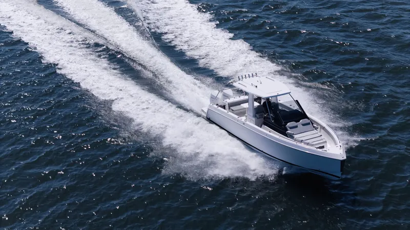 Slide: The Image of Schaefer V33SF 2027 motorboat cruising on open sea. - 2