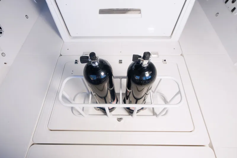 Slide: The Image of Two black gas cylinders in a 2027 Schaefer V33SF boat. - 31