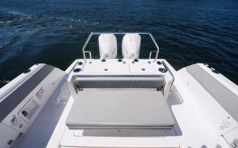 Slide: The Image of Schaefer V33SF 2027 boat rear with engines on open water. - 8