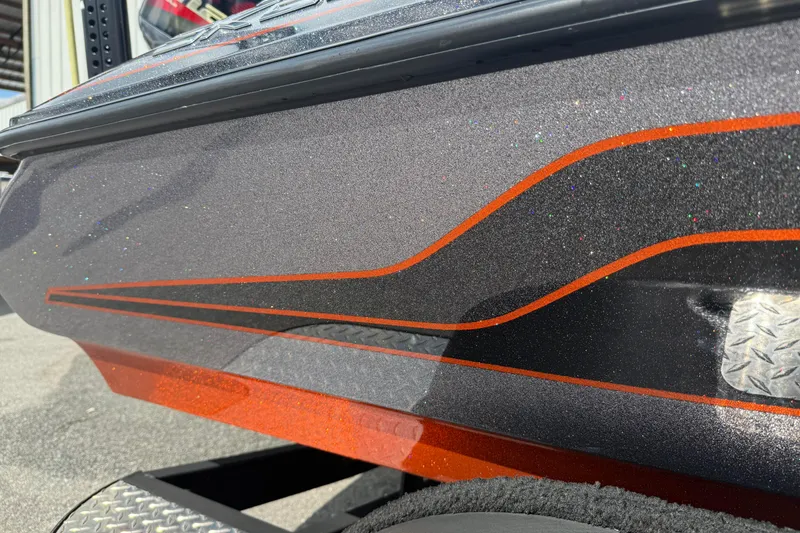 Slide: The Image of 2019 Skeeter ZX225 boat with glittery gray and orange detailing. - 17