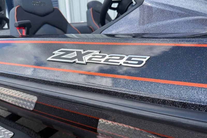 Slide: The Image of 2019 Skeeter ZX225 boat with sleek design and bold orange accents. - 2