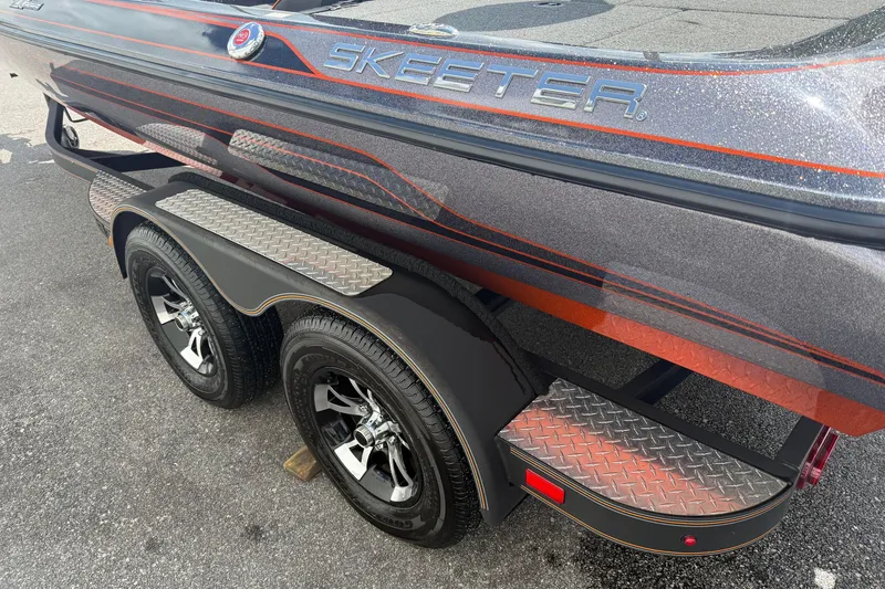 Slide: The Image of 2019 Skeeter ZX225 boat with dual axle trailer and metallic finish. - 6