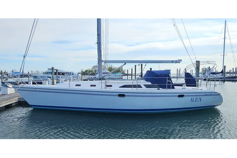 Slide: The Image of 2006 Catalina 42 MkII sailboat docked in marina, side view. - 1