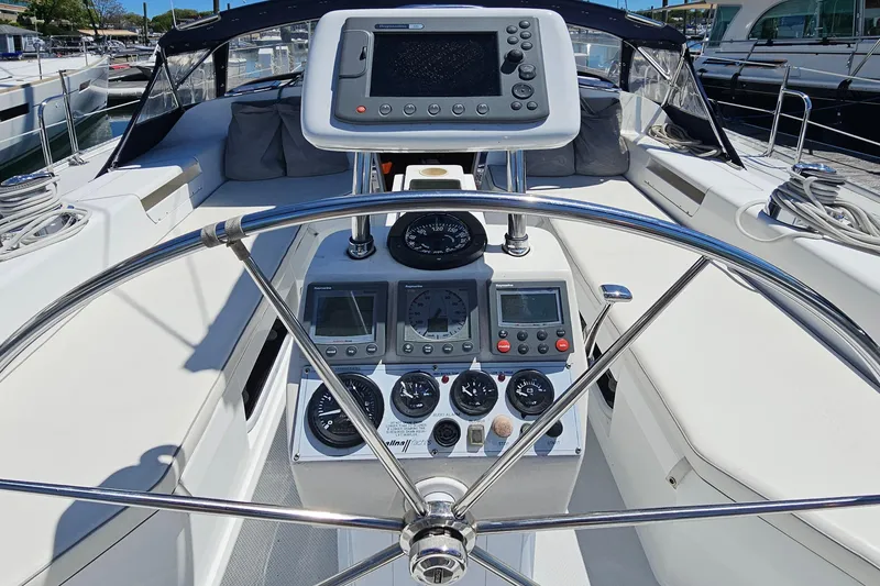 Slide: The Image of Steering wheel and control panel of a 2006 Catalina 42 MkII yacht. - 11