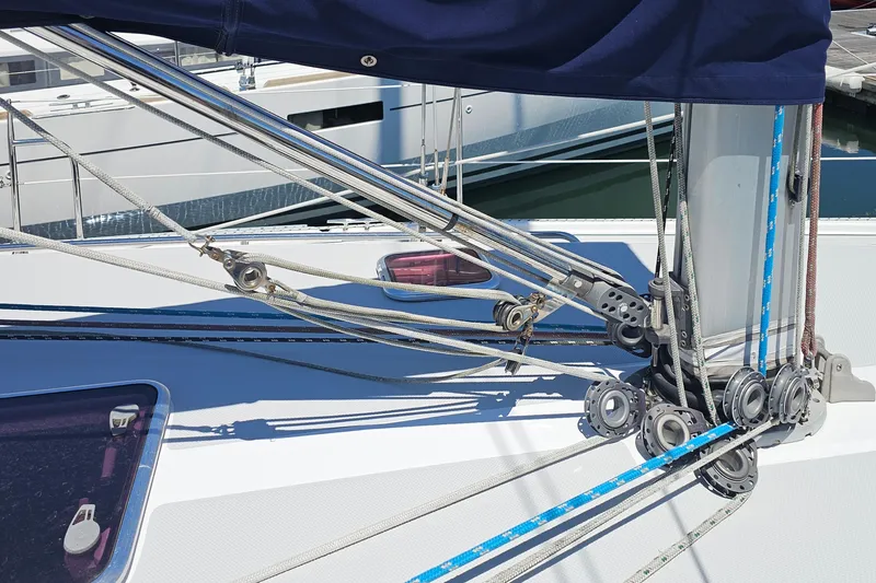 Slide: The Image of Close-up of Catalina 42 MkII sailboat rigging, showcasing ropes and pulleys, 2006 model. - 12