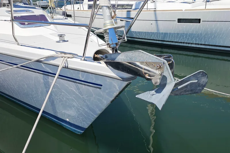Slide: The Image of Catalina 42 MkII 2006 sailboat anchored in marina, featuring a prominent anchor. - 13