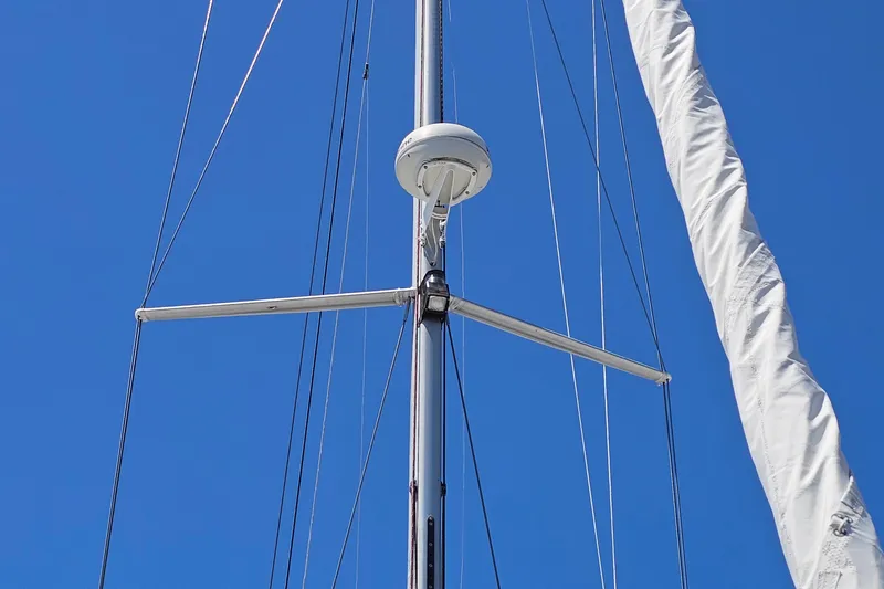 Slide: The Image of Mast and rigging of a 2006 Catalina 42 MkII sailboat against a clear blue sky. - 17