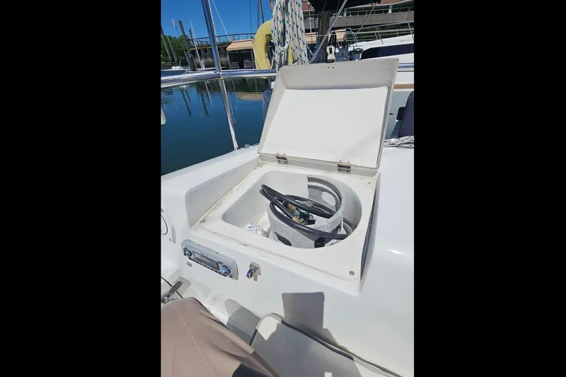Slide: The Image of Open storage compartment on a 2006 Catalina 42 MkII sailboat, docked at a marina. - 18