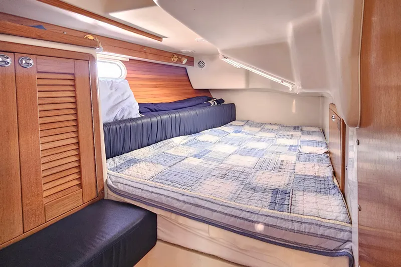 Slide: The Image of Cozy cabin interior of 2006 Catalina 42 MkII sailboat with quilted bedding. - 33